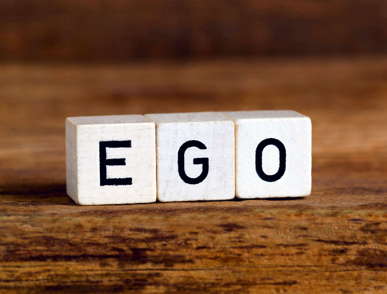 image of letter blocks spelling the word "ego"