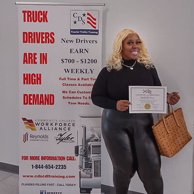 Image of CDS grad, Shameika Price, posing with her certificate